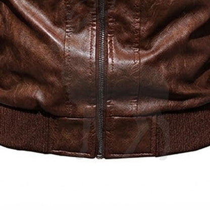Close up lower zipper detail on men’s brown hooded leather biker jacket with vintage distressed genuine leather finish