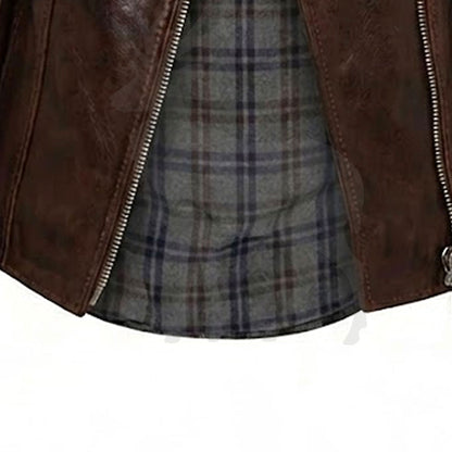 Close up lower asymmetrical zipper detail on men’s brown leather biker jacket with vintage motorcycle style finish