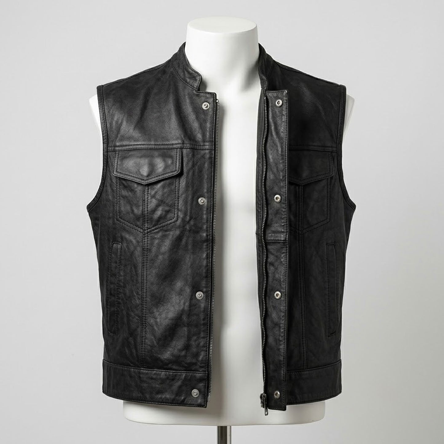Black leather vest snap button closure detail