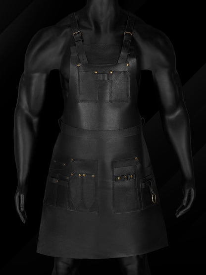 Front view of black leather barber apron with tool pockets.