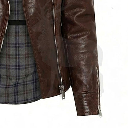 Close up sleeve zipper of brown leather biker jacket with metal zip cuff detail adjustable wrist design premium finish