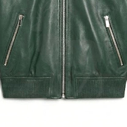 Close up lower front zipper detail on green leather bomber jacket minimalist design premium metal zip smooth genuine leather streetwear finish