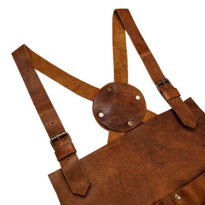 Cross-back strap detail of heavy-duty leather workshop apron