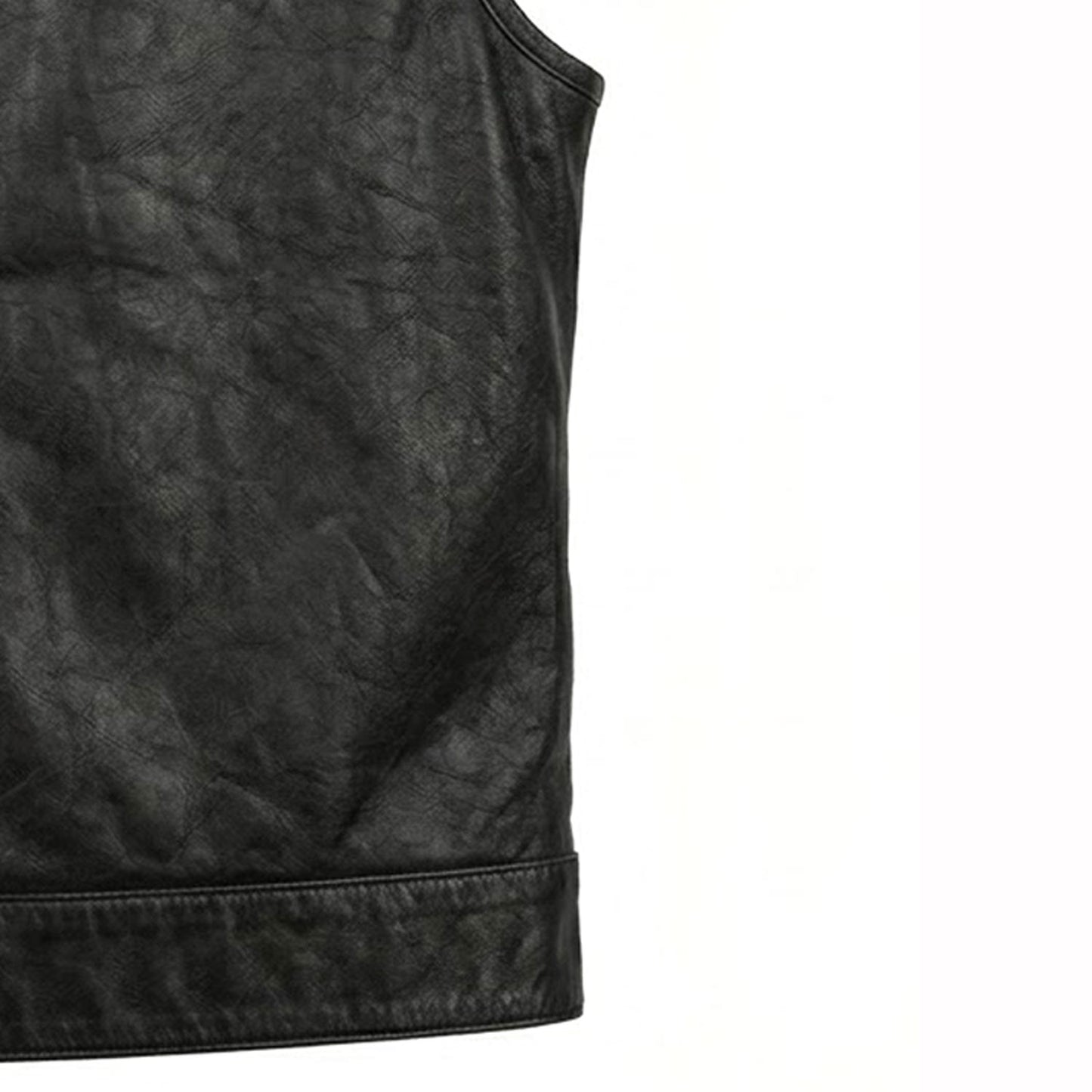 bottom hem and side construction detail of black buffalo leather vest