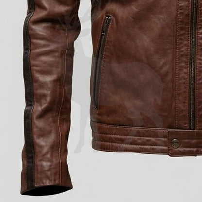 Close up zip pocket detail on men’s brown leather biker jacket functional storage pocket and premium stitching