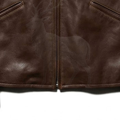 Close up lower zipper detail on men’s brown leather jacket