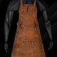 Handmade full-grain pull-up leather BBQ apron featuring adjustable leather straps, brass buckles, dual towel rings, and multiple tool pockets. Designed for chefs, barbers, grill enthusiasts, and DIY professionals seeking a durable, personalized workwear solution. Ideal as a custom gift for Dad, Mom, or any hardworking individual.

