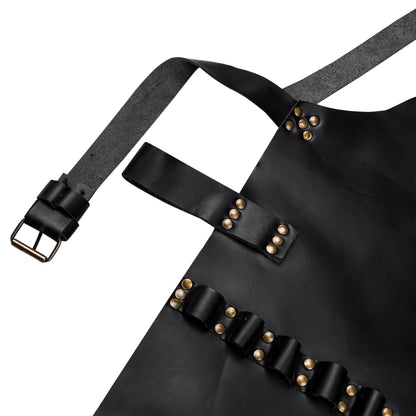 Macro detail of artisan leather apron stitching and buckle hardware